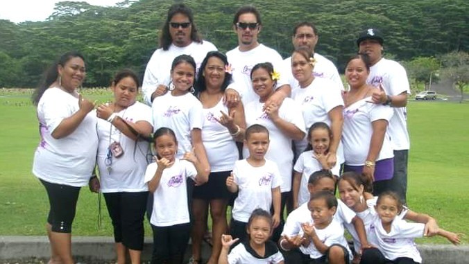 Windward CC student Lynette Santos (with pink flower) has 13 grandchildren and four great grandchildren.