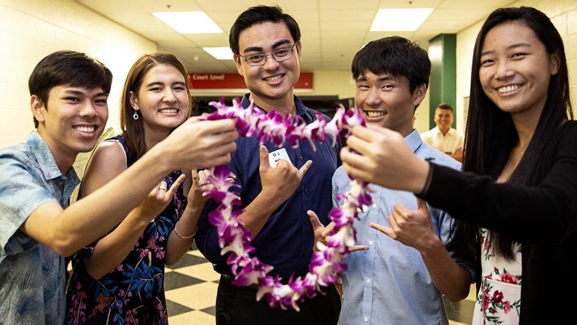 Scholarship recipients with lei