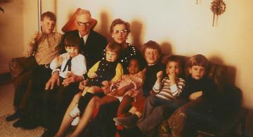 Mark with grandparents on couch
