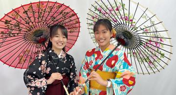 Marcy Tokunaga posing with friend in traditional Japanese attire