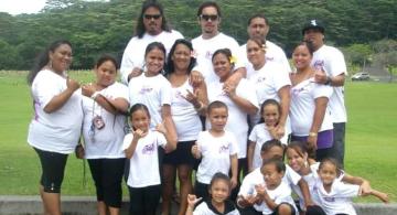 Windward CC student Lynette Santos (with pink flower) has 13 grandchildren and four great grandchildren.