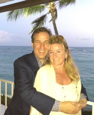 Rich and Eileen Wacker on a lanai with the ocean in the background.